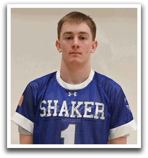 A young man wearing a blue and white jersey with the number 1 on it. Description generated by AI