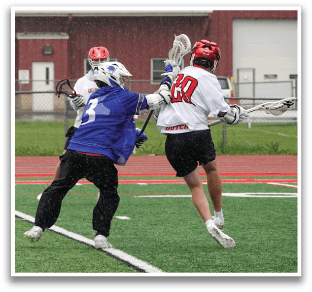 A man wearing a blue and white jersey is running on a field. Description generated by AI