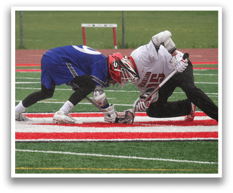 Two men playing a game of lacrosse. Description generated by AI