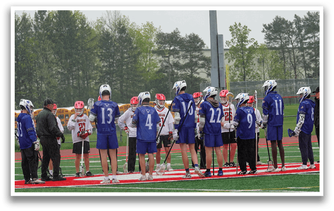 A group of people wearing blue and white uniforms. Description generated by AI