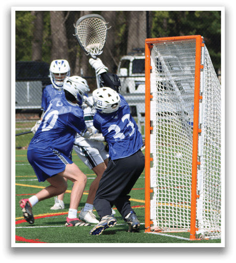 A group of people playing lacrosse. Description generated by AI