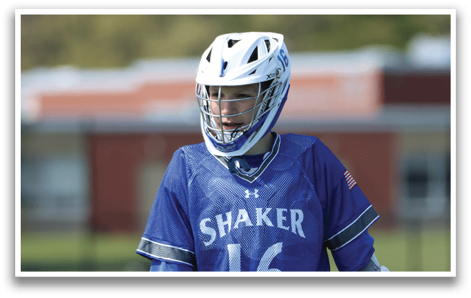 A young man wearing a blue and white jersey with the number 16 on it. Description generated by AI