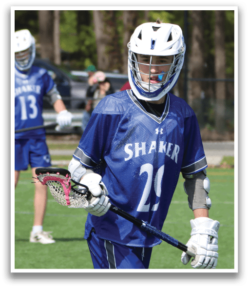 A young man wearing a blue and white jersey with the number 21 on it. Description generated by AI