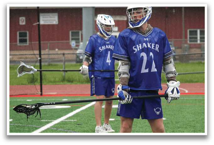 A man wearing a blue and white jersey with the number 22 on it. Description generated by AI