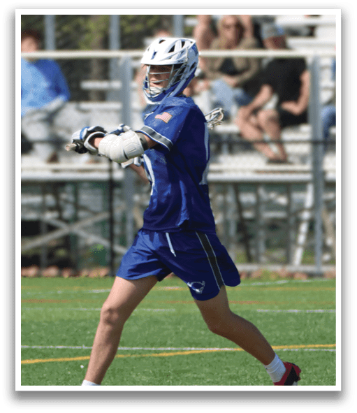A man wearing a blue and white uniform is running on a field. Description generated by AI