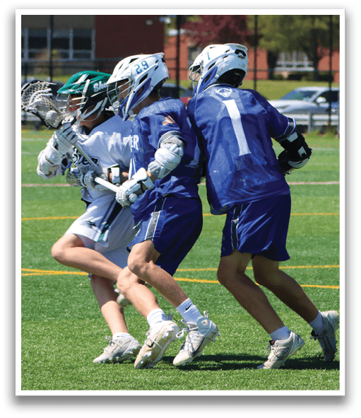 Three men playing lacrosse on a field. Description generated by AI