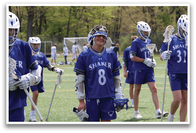 A group of people wearing blue and white uniforms. Description generated by AI