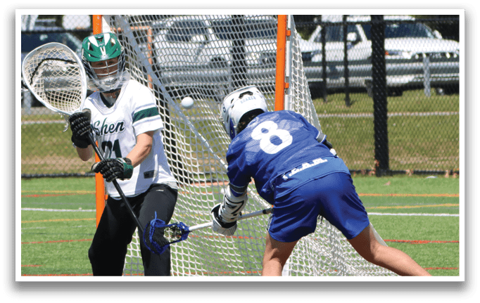 A man in a blue shirt and shorts is playing lacrosse. Description generated by AI