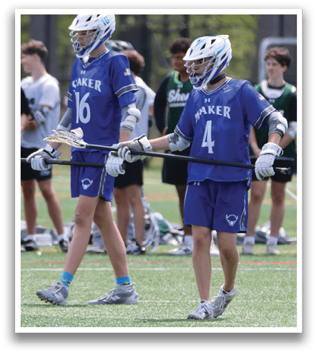 Two boys wearing blue and white uniforms with the number 16 and 4 on their shirts. Description generated by AI