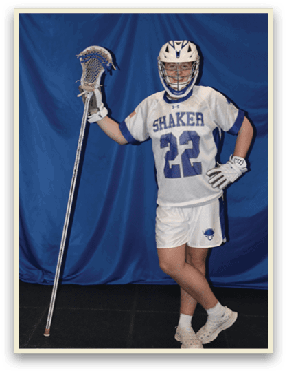 A man wearing a Shaker jersey holds a lacrosse stick. AI generated content