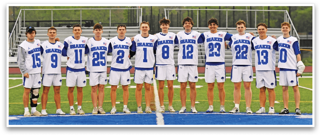 A group of young men wearing blue and white uniforms. Description generated by AI