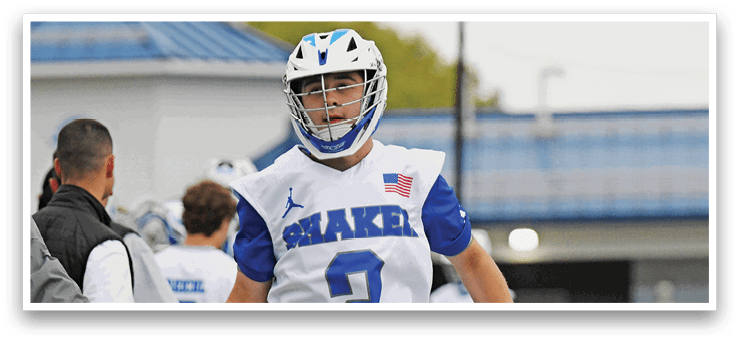 A man wearing a white and blue jersey with the number 2 on it. Description generated by AI