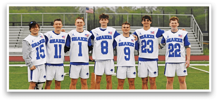 A group of young men wearing blue and white jerseys. Description generated by AI