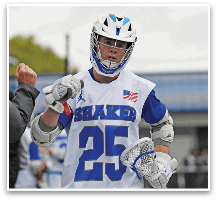 A man wearing a white and blue jersey with the number 25 on it. Description generated by AI