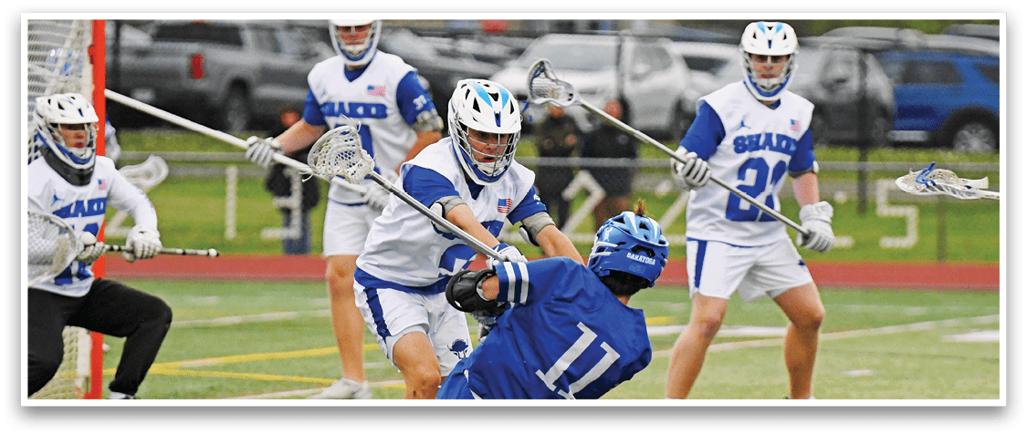 A group of people playing lacrosse. Description generated by AI