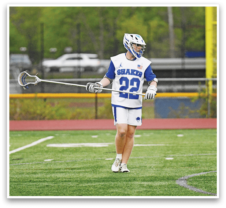 A man wearing a blue and white jersey with the number 22 on it. Description generated by AI