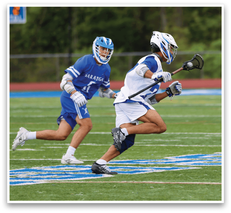 A man in a blue and white uniform is running on a field. Description generated by AI