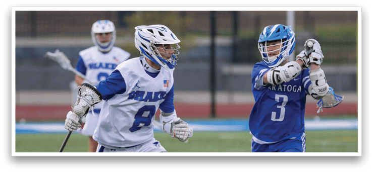 Two men playing lacrosse. Description generated by AI
