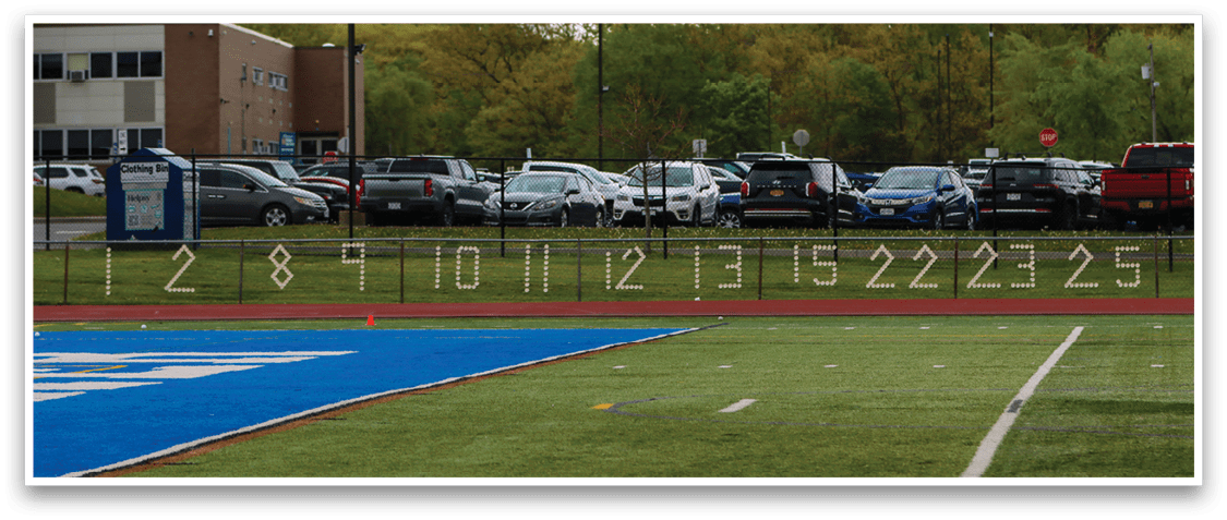 A field with a blue and white grid. Description generated by AI
