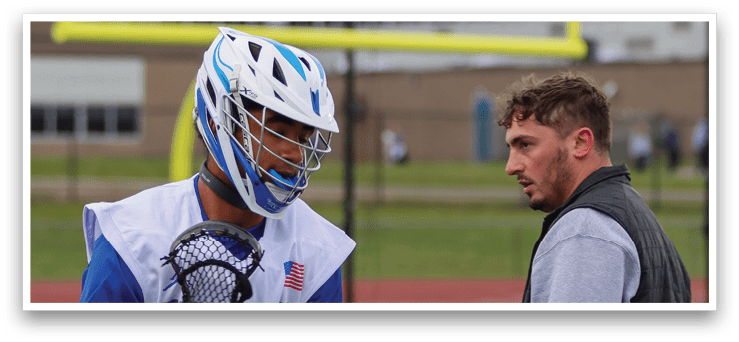A man wearing a white and blue jersey with the number 22 on it. Description generated by AI
