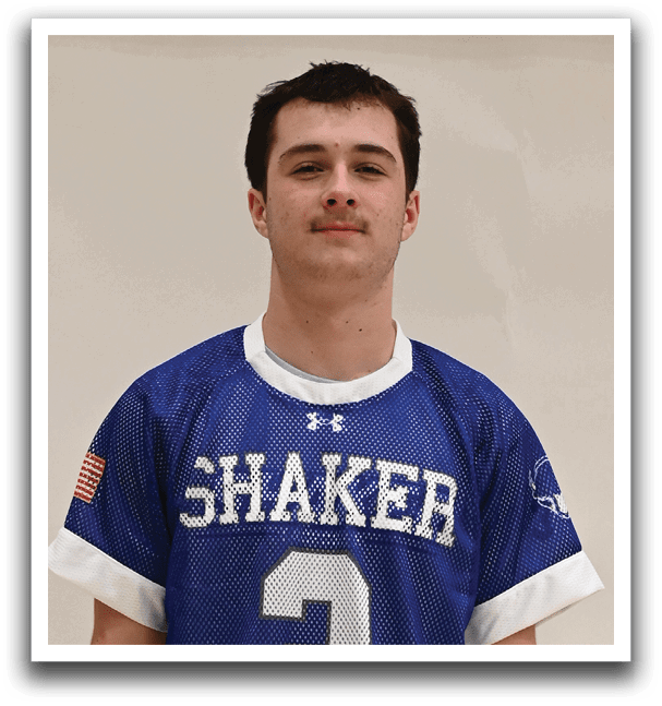 A man wearing a blue and white jersey with the number 2 on it. Description generated by AI