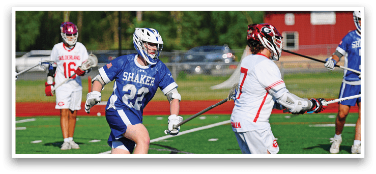 A man wearing a blue and white jersey is running on a field. Description generated by AI