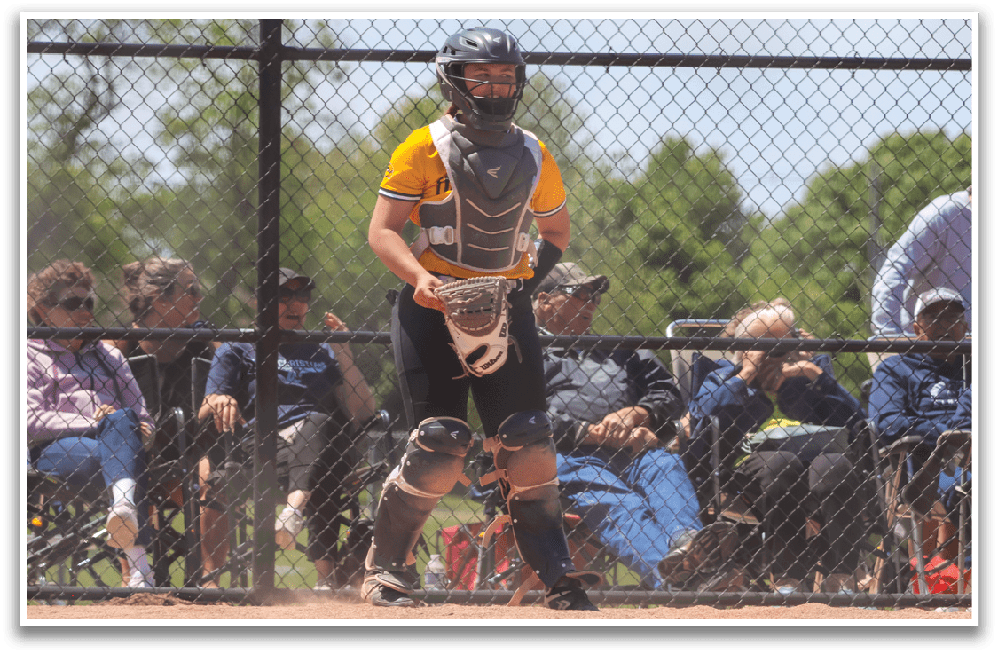 A baseball player wearing a helmet and catcher's mitt. Description generated by AI