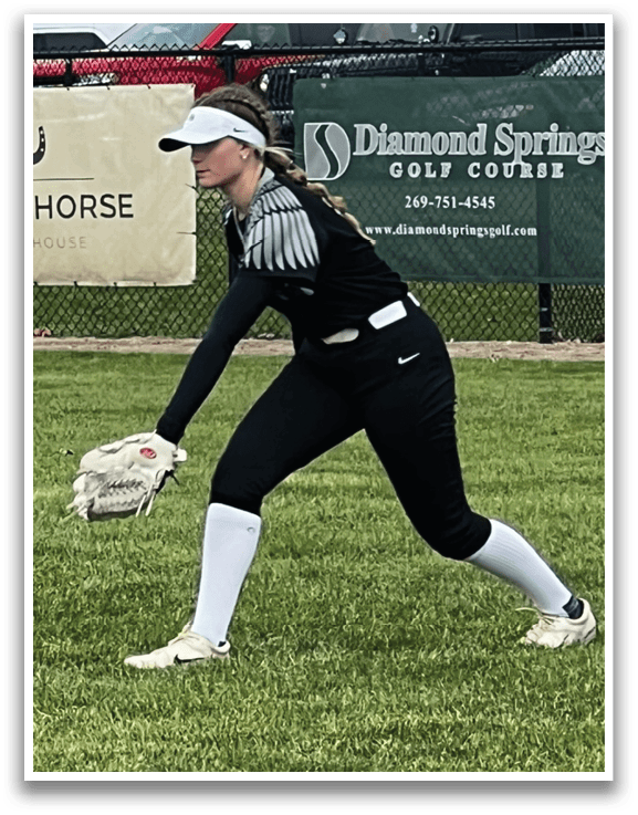 A woman in a black and white shirt is playing baseball. AI generated content