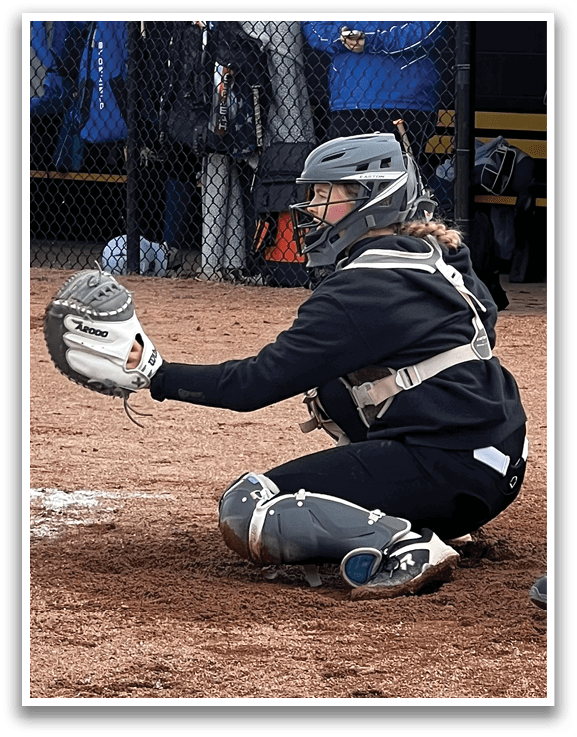 A baseball catcher is kneeling down in front of a batter, wearing a helmet and holding a baseball glove. AI generated content