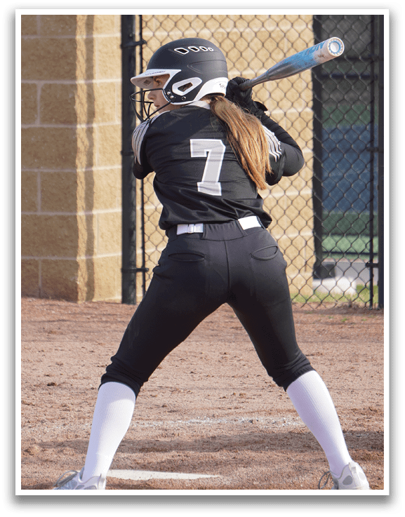 A female baseball player is swinging a bat, attempting to hit a ball. AI generated content