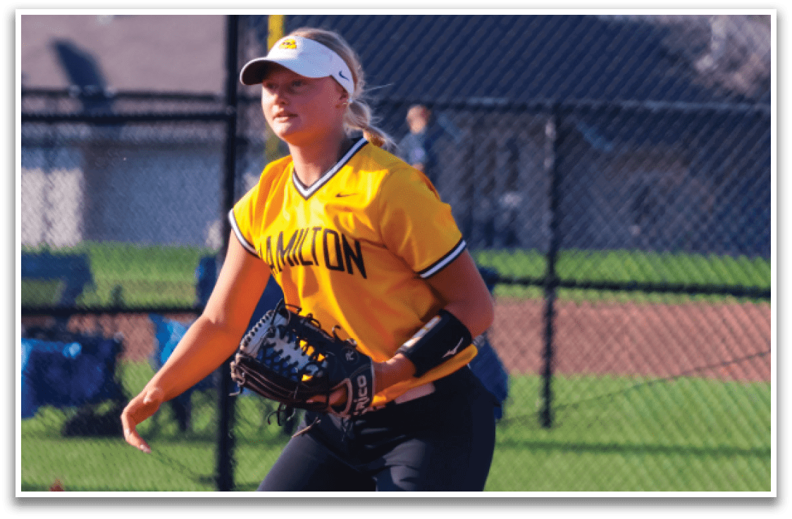 A woman wearing a yellow and black shirt and black pants is playing baseball. AI generated content
