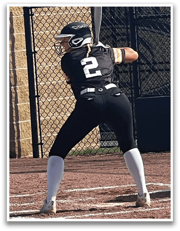 A woman wearing a yellow shirt and black pants is catching a ball. AI generated content