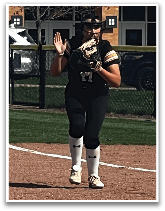 A woman is running on a baseball field, wearing a black shirt and white socks. She is holding a baseball glove in her hand. There are cars parked in the background, and a bench is visible near the edge of the field. AI generated content