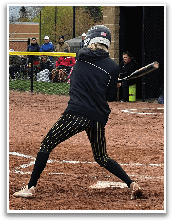 A woman is swinging a baseball bat, attempting to hit a ball. AI generated content