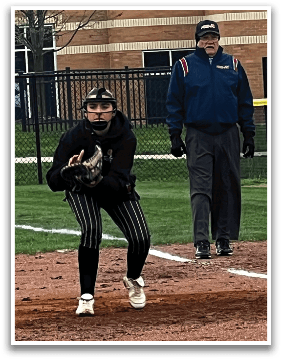 A female baseball player is in the field, holding a mitt and ready to catch the ball. AI generated content