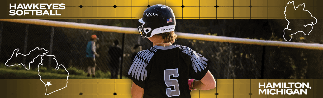 A woman wearing a softball uniform standing in front of a map of the United States. Description generated by AI