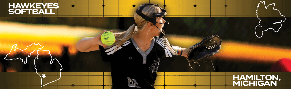 A woman wearing a black and white shirt and a black hat throwing a softball. Description generated by AI