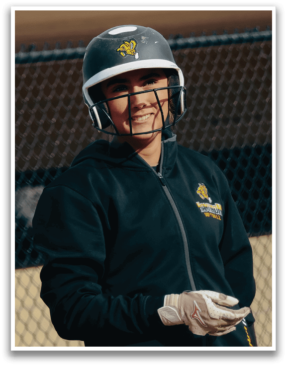 A woman wearing a black jacket and a helmet. Description generated by AI