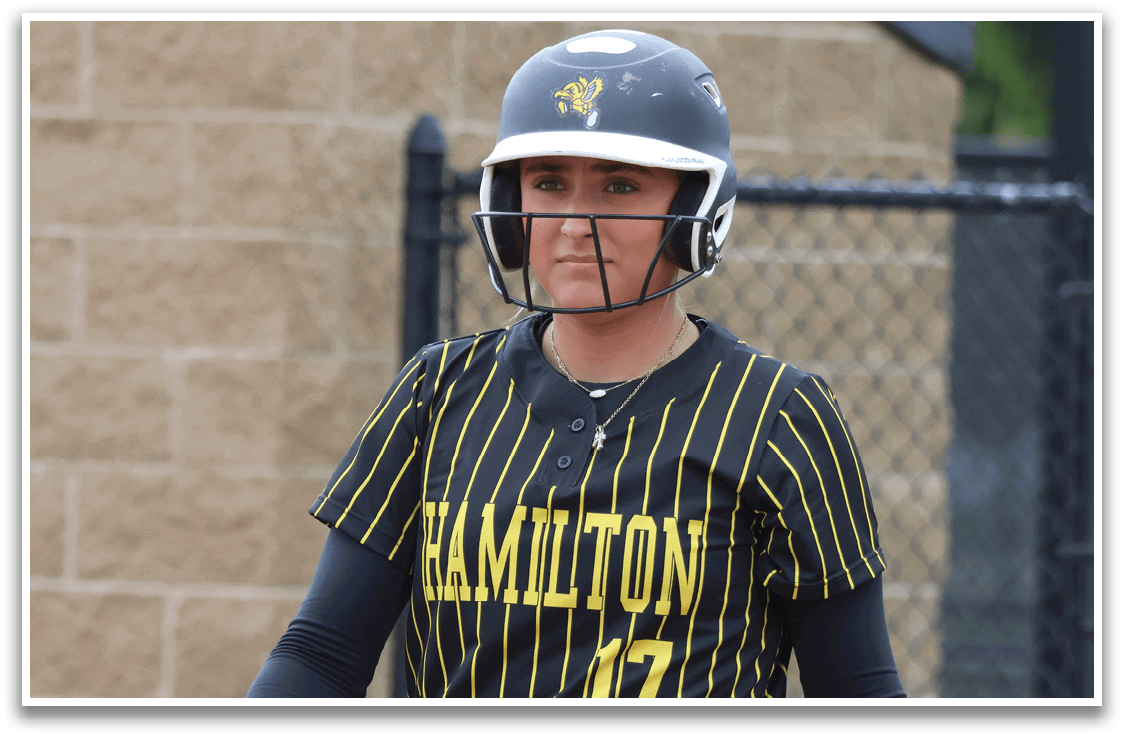 A baseball player wearing a black and yellow jersey with the number 17. Description generated by AI