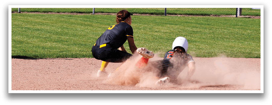 A girl sliding into a base. Description generated by AI