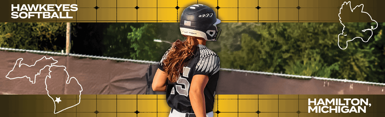 A woman wearing a softball uniform. Description generated by AI
