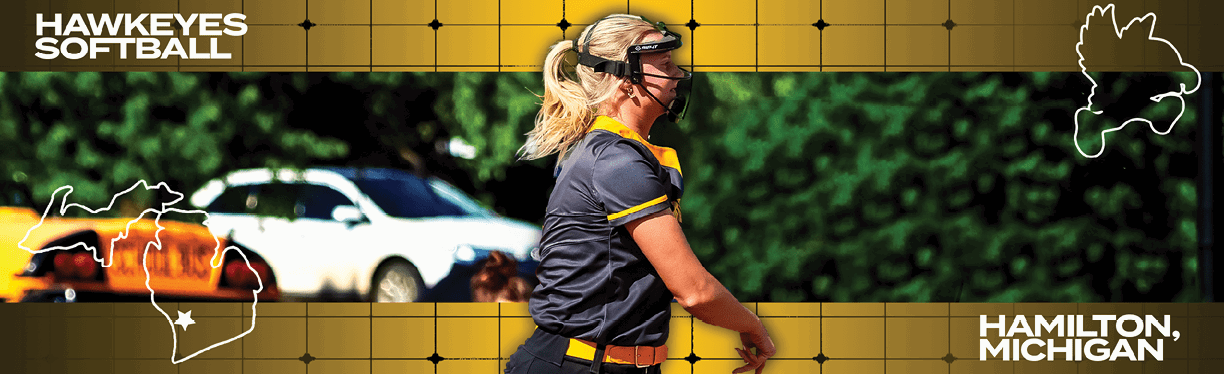 A woman wearing a softball uniform. Description generated by AI