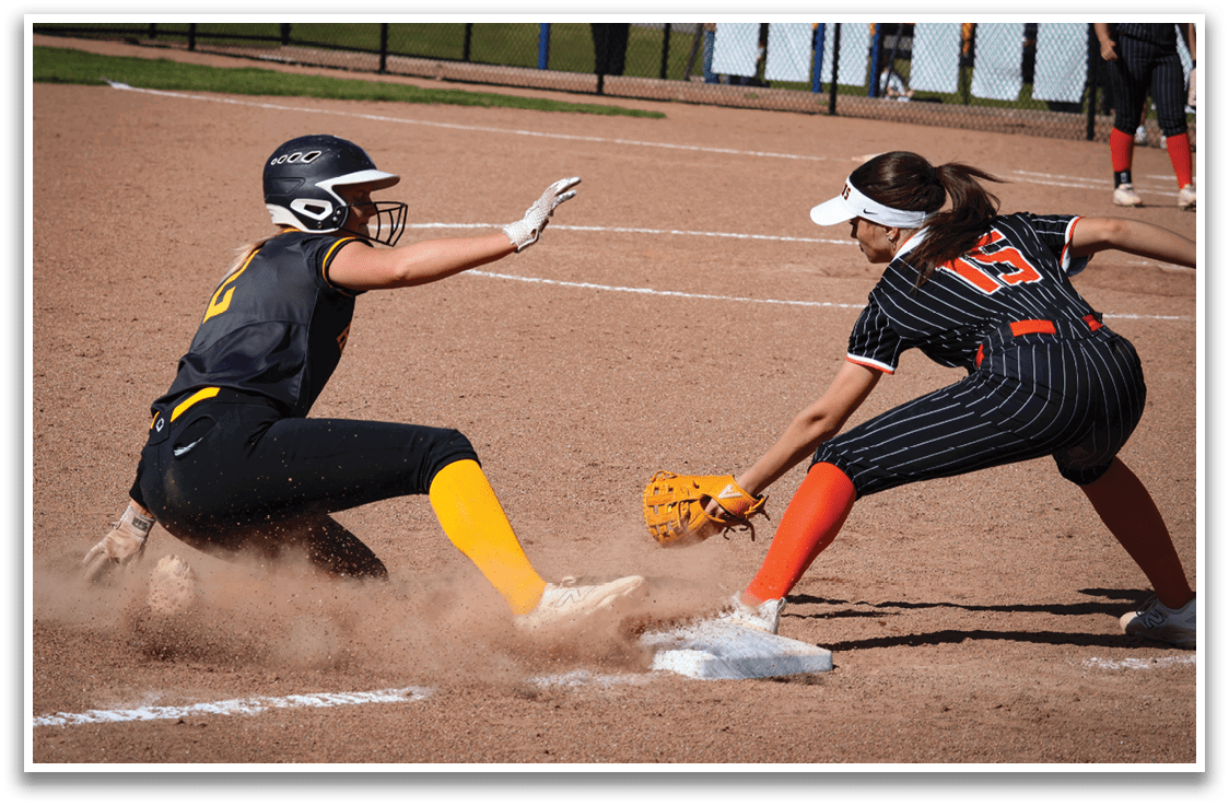 A girl sliding into a base. Description generated by AI