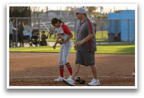 A group of girls playing softball on a field. AI generated content