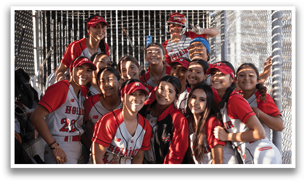 A group of girls wearing red and white uniforms. Description generated by AI