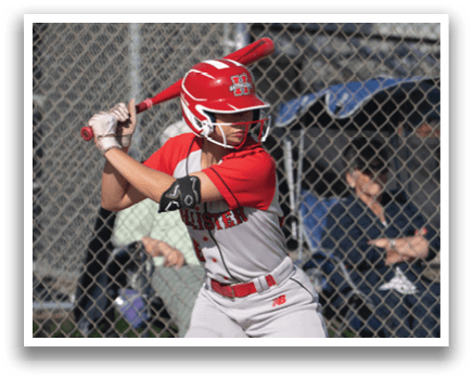 A baseball player in a red helmet and white uniform is swinging a bat. Description generated by AI
