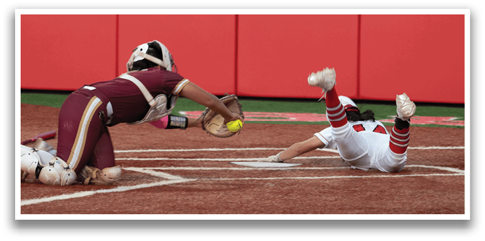 A baseball player slides into home plate. Description generated by AI
