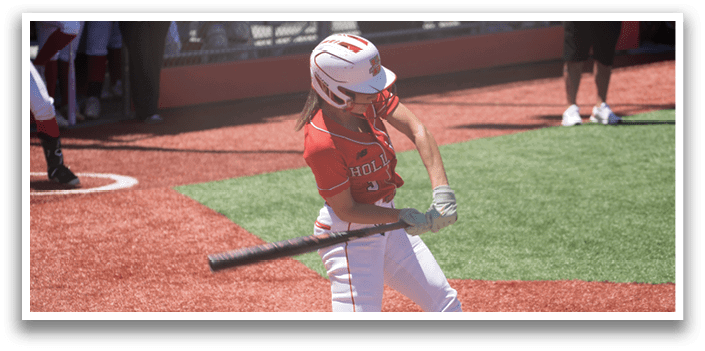 A baseball player is swinging a bat at a ball. Description generated by AI