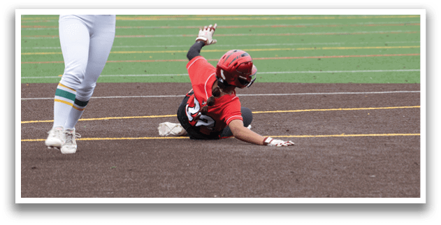 A baseball player slides into a base. Description generated by AI
