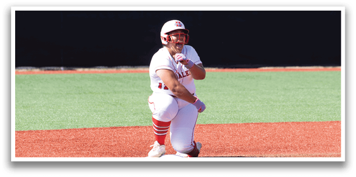A baseball player is standing on the field. Description generated by AI